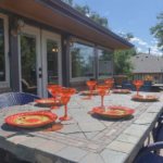 Outdoor dining on the expansive deck at the Red Rocks in Wheatridge is the nearly 360 days of enjoying sunshine in Colorado every year.
